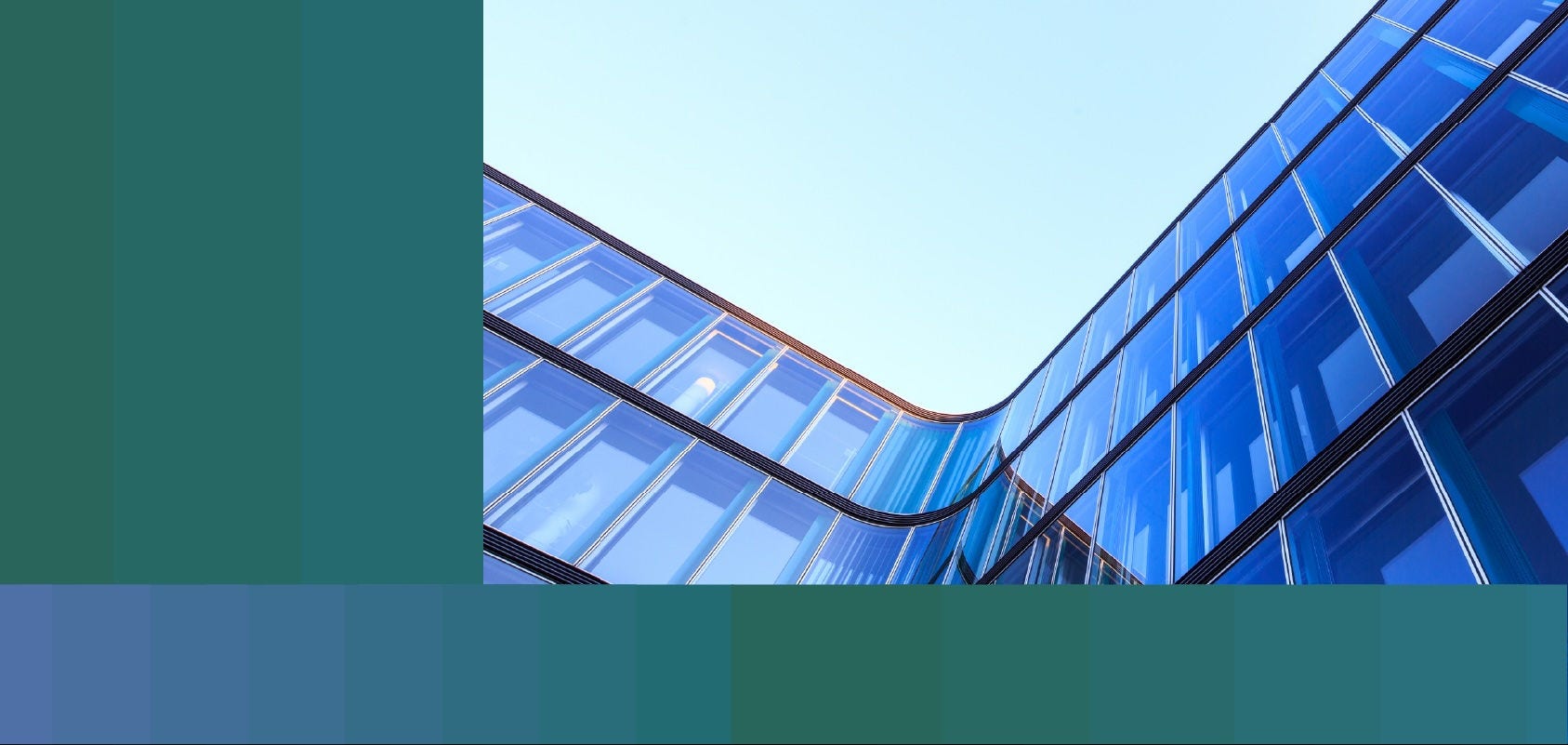 Low-angle photo of the curved glass façade of an office building.