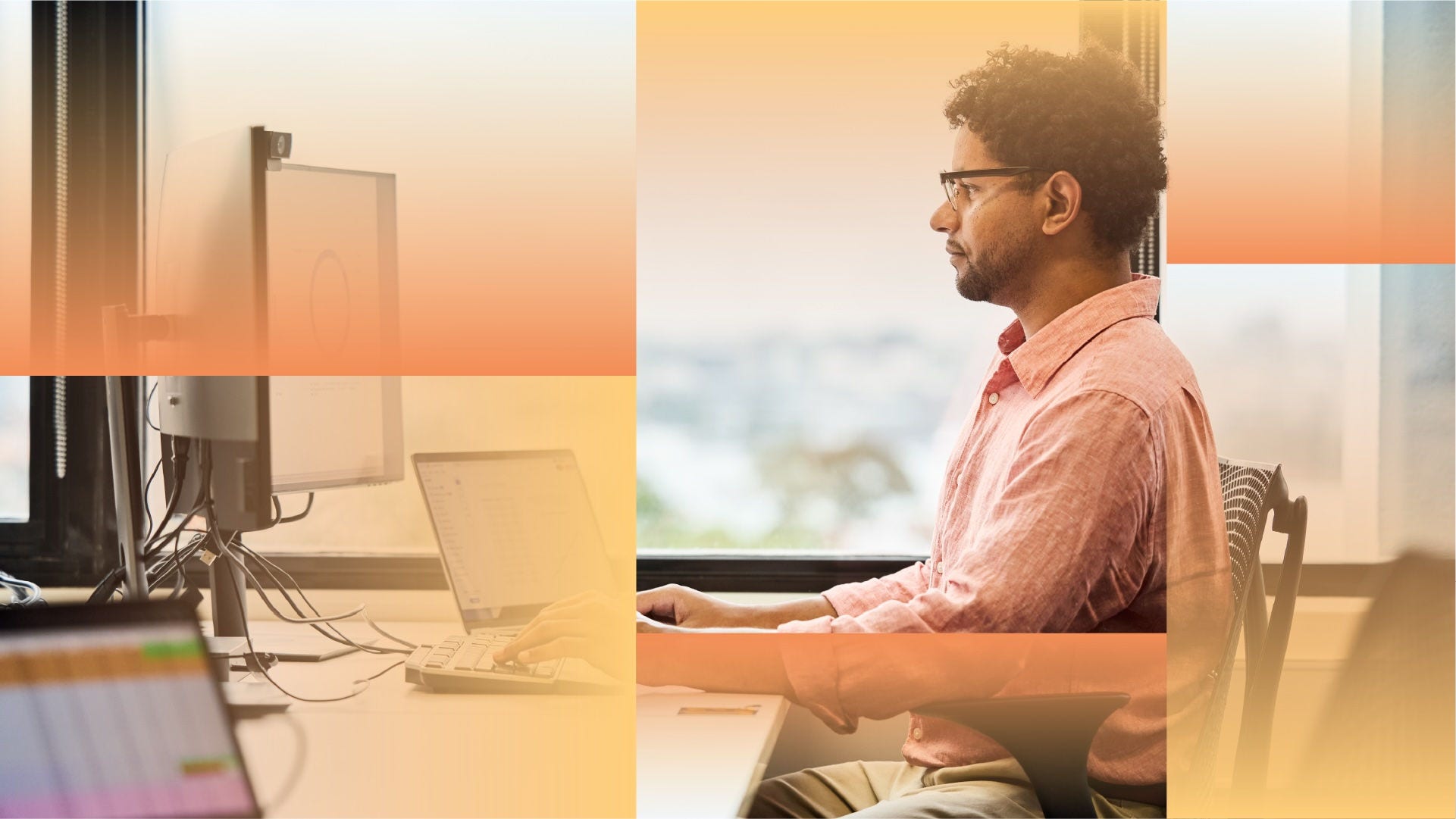 Person seated at a desk in a modern office, working at a computer workstation with multiple monitors and a laptop near a large window, with warm-toned graphic overlays across the image.